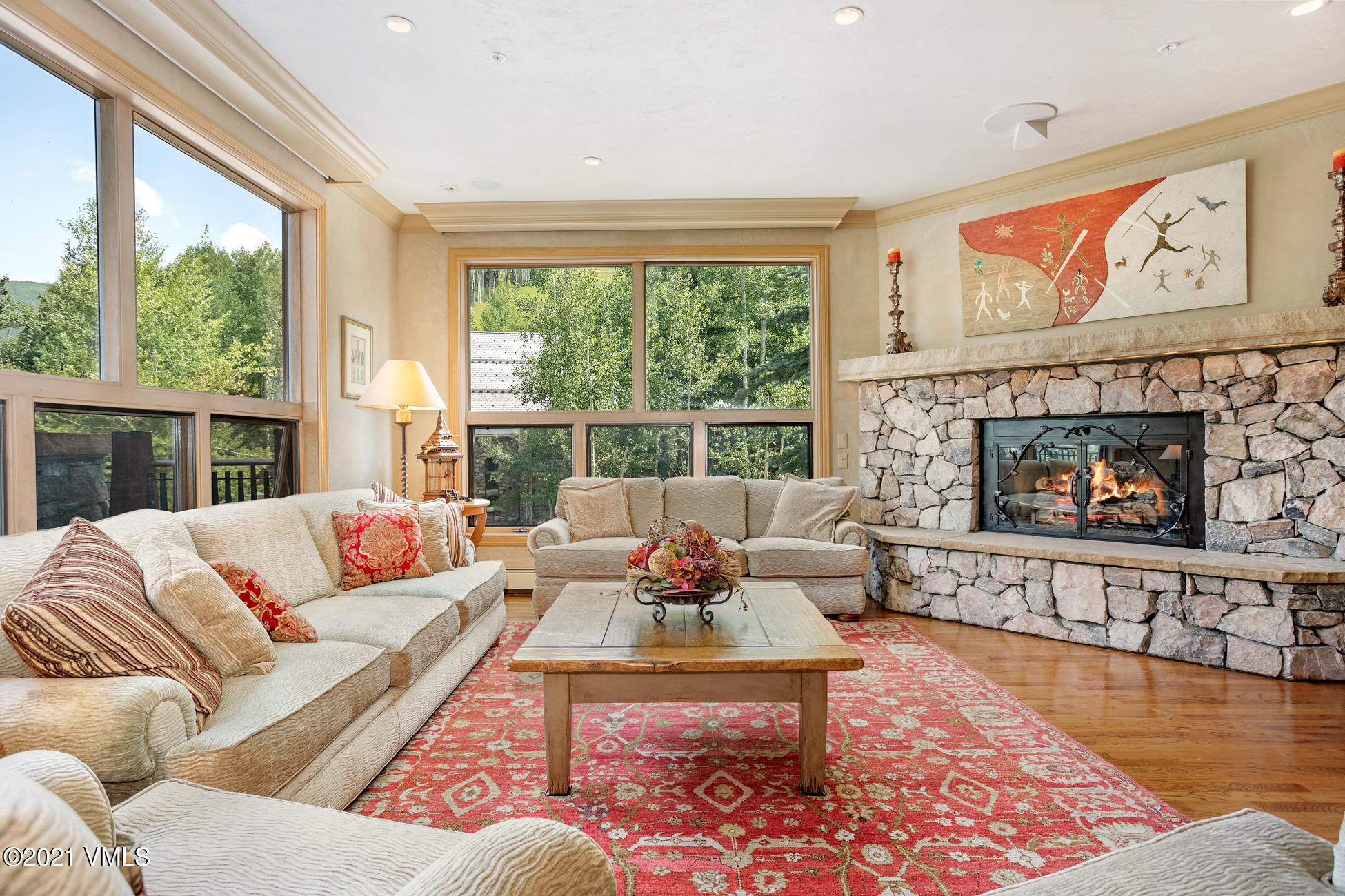40 Elk Track Road, Unit 1 Beaver Creek, CO 81620 - Photo 3 of 31 a living room with furniture large window and a fireplace