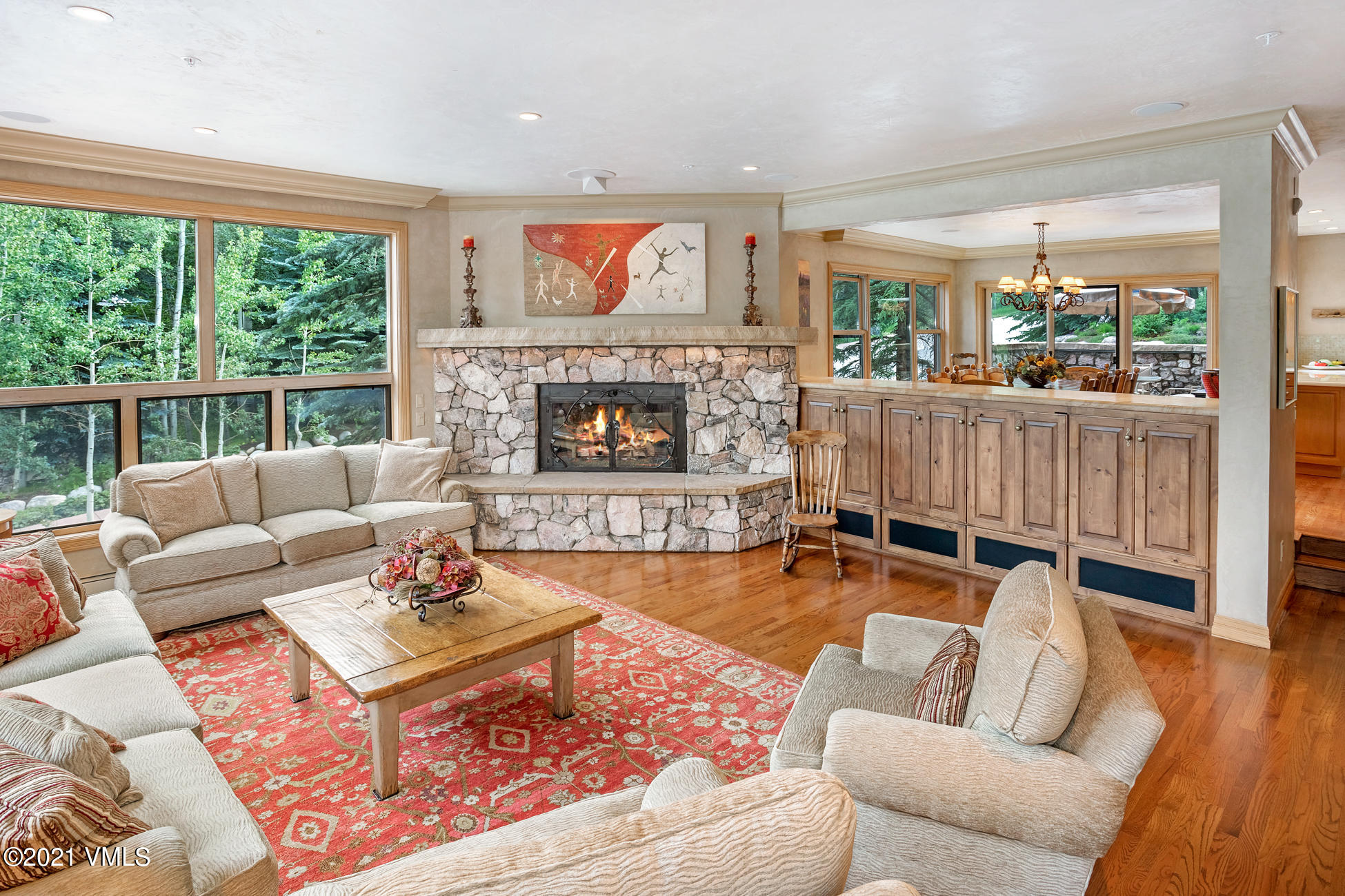 40 Elk Track Road, Unit 1 Beaver Creek, CO 81620 - Photo 4 of 31 a living room with furniture fireplace and a large window