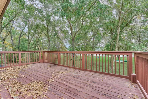 a view of balcony with wooden floor
