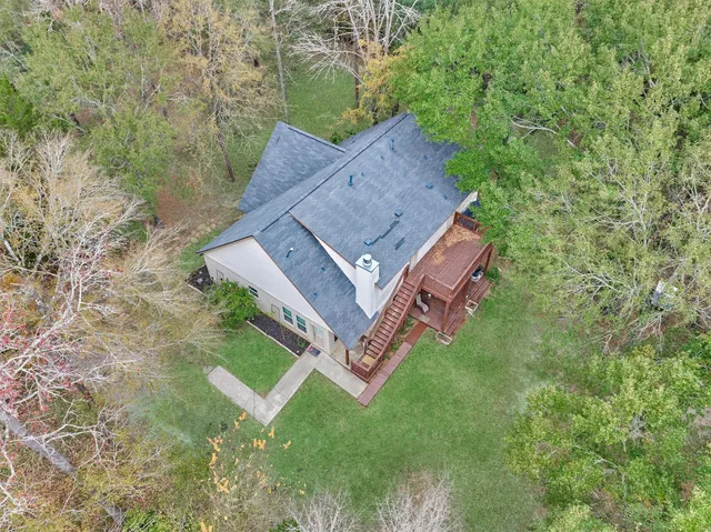 an aerial view of a house with a garden