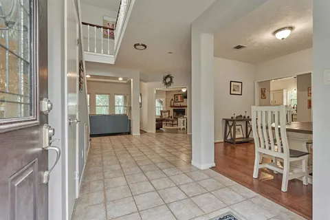 a view of entryway and hall with a front door