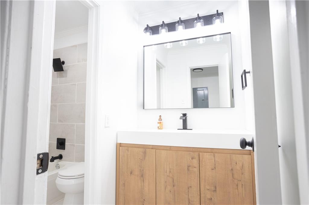 3232 Abbeywood Drive Decatur, GA 30034 - Photo 13 of 17 a bathroom with a double vanity sink mirror and toilet