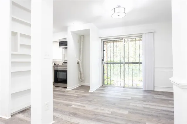 a view of an empty room with a window