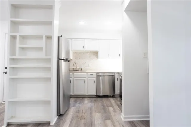a room with cabinets and a stove