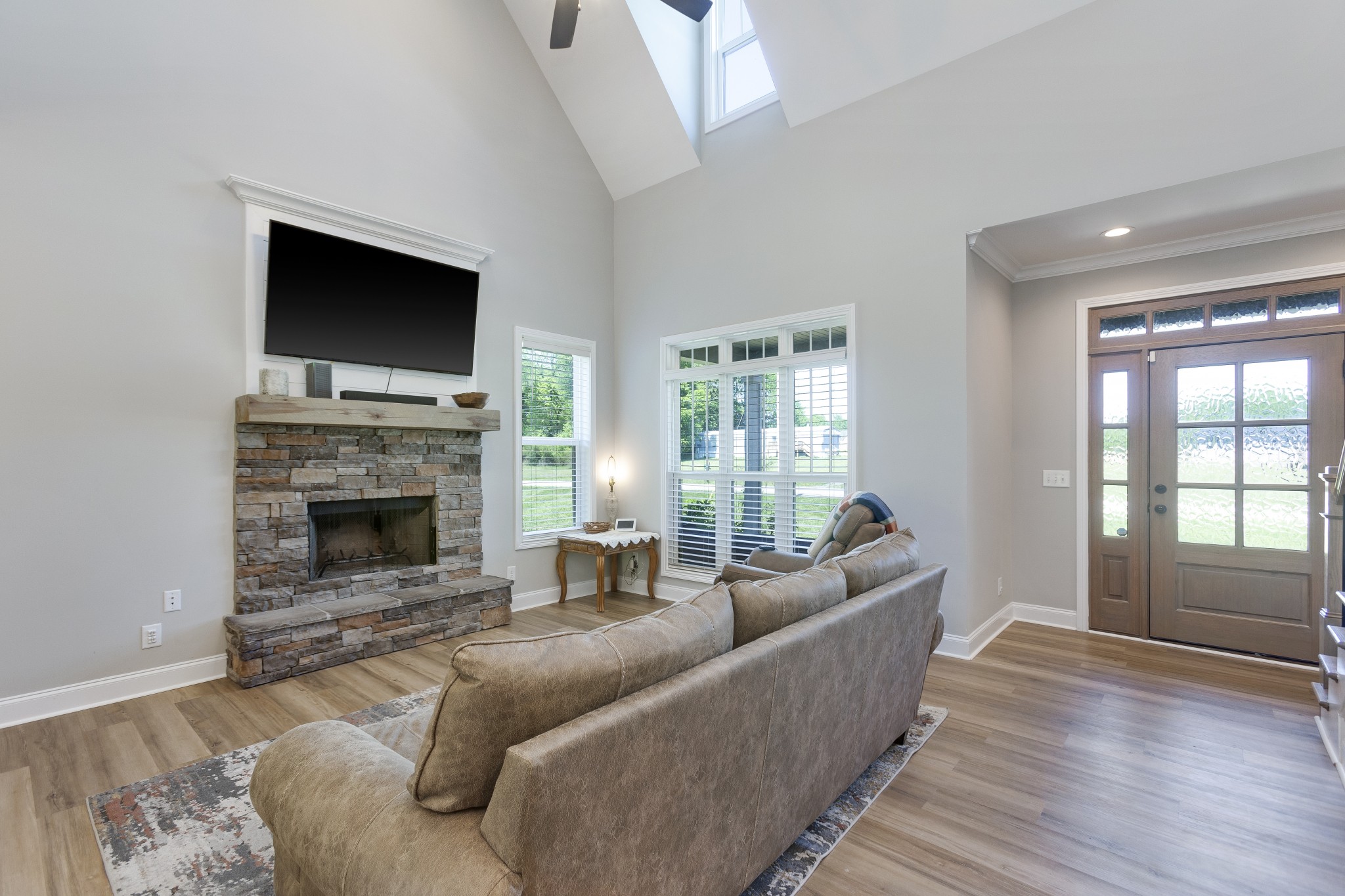 20 Shema Lane Lebanon, TN 37087 - Photo 6 of 38 a living room with furniture a flat screen tv and a fireplace