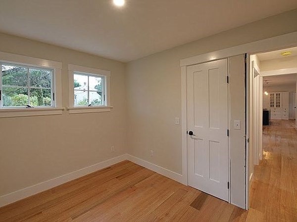 760 Shore Road Bourne, MA 02559 - Photo 19 of 34 a view of an empty room with wooden floor and a window