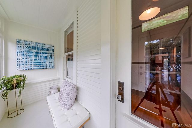 a room with furniture and a potted plant