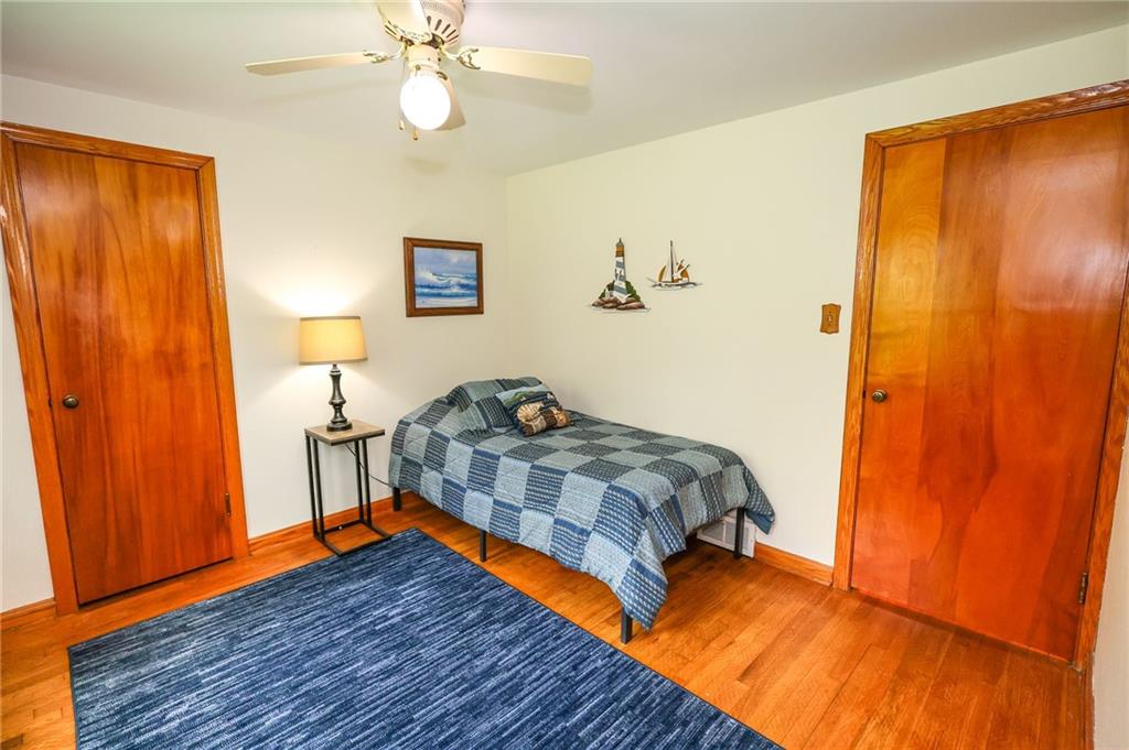 1069 North Keel Ridge Road Hermitage, PA 16148 - Photo 31 of 50 a bedroom with a bed and wooden floor