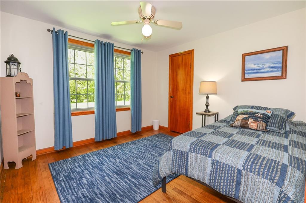 1069 North Keel Ridge Road Hermitage, PA 16148 - Photo 32 of 50 a bedroom with a bed and wooden floor