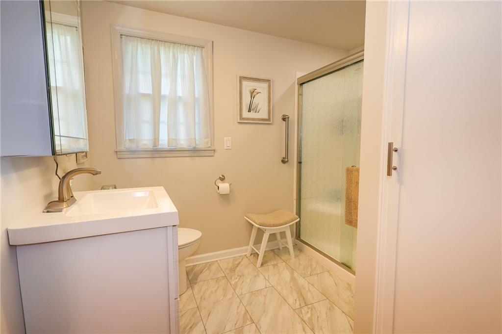 1069 North Keel Ridge Road Hermitage, PA 16148 - Photo 34 of 50 a bathroom with a sink a toilet and shower