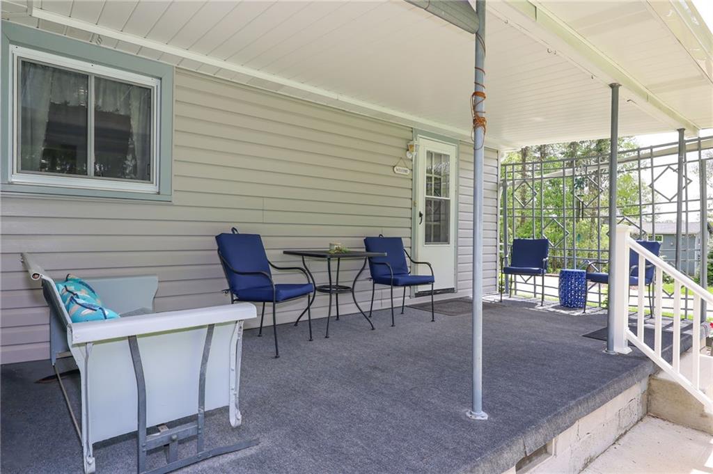 1069 North Keel Ridge Road Hermitage, PA 16148 - Photo 44 of 50 a view of a patio with a table and chairs