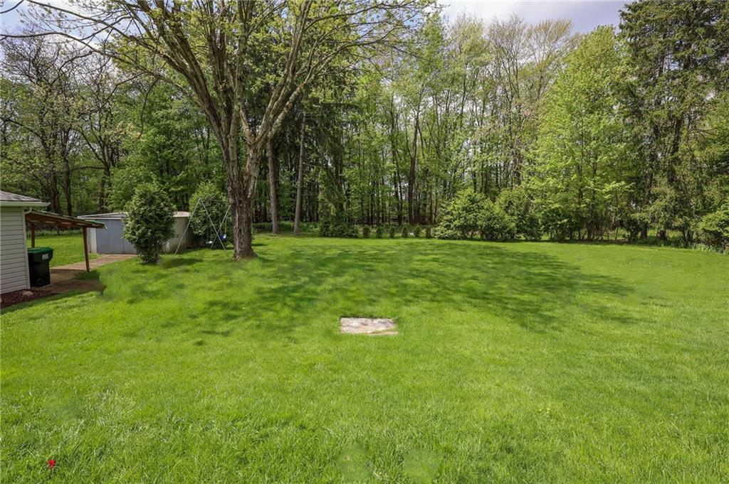 1069 North Keel Ridge Road Hermitage, PA 16148 - Photo 46 of 50 a backyard of a house with lots of green space