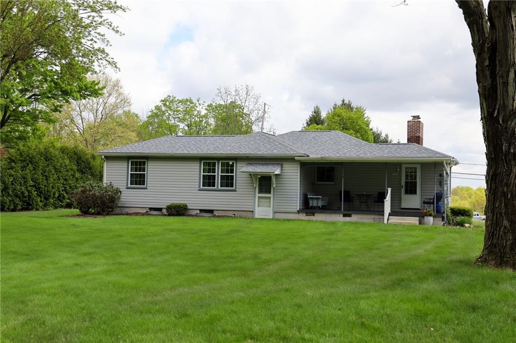 1069 North Keel Ridge Road Hermitage, PA 16148 - Photo 5 of 50 a front view of a house with a garden