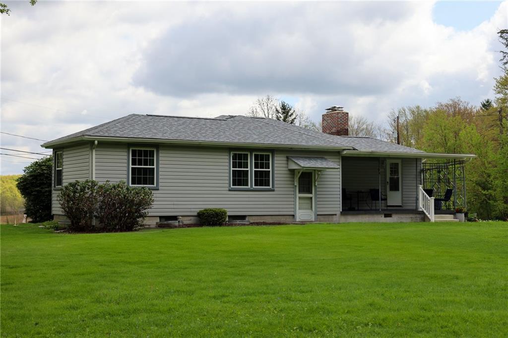 1069 North Keel Ridge Road Hermitage, PA 16148 - Photo 7 of 50 a front view of a house with a yard and green space