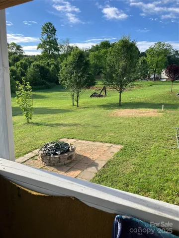 a view of a park with large trees