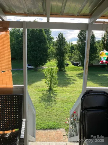 a view of a swimming pool with a porch