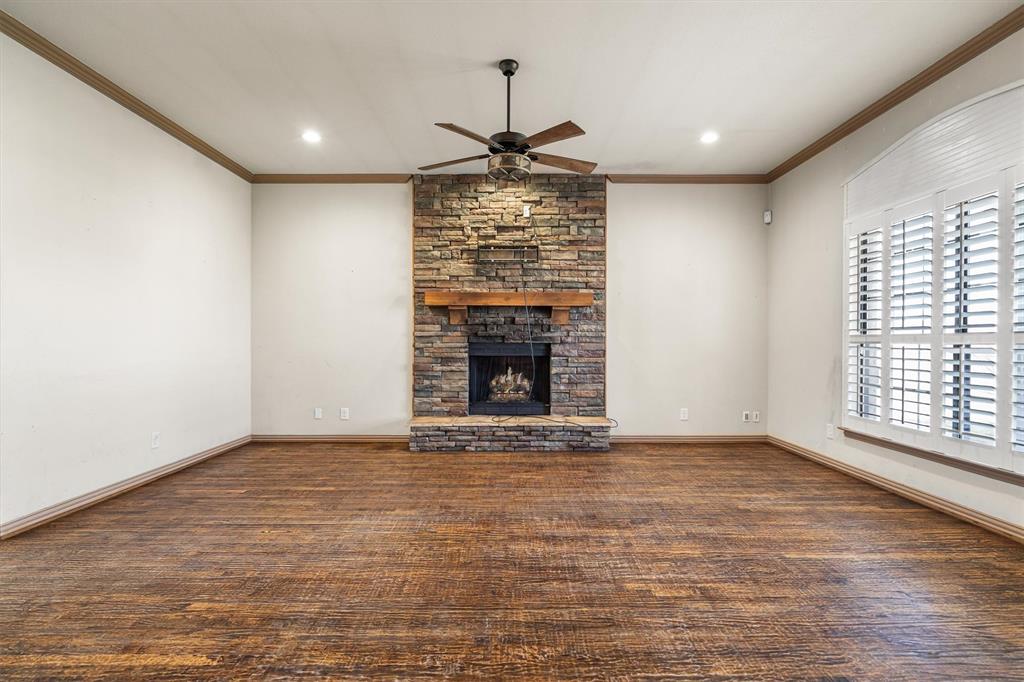 6210 Deer Run Road Sanger, TX 76266 - Photo 13 of 40 an empty room with windows and fireplace