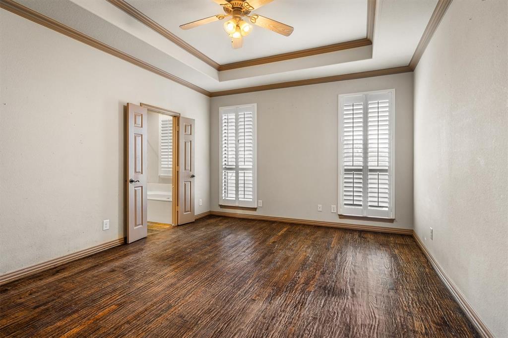 6210 Deer Run Road Sanger, TX 76266 - Photo 18 of 40 a view of an empty room with wooden floor and a window