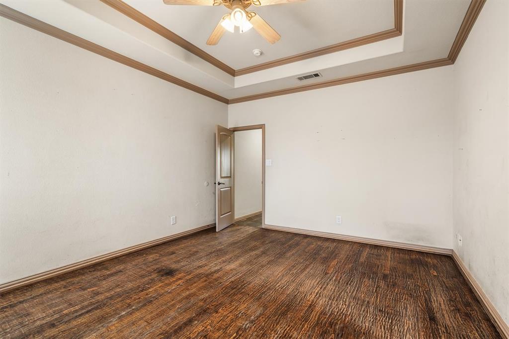 6210 Deer Run Road Sanger, TX 76266 - Photo 19 of 40 a view of an empty room with wooden floor