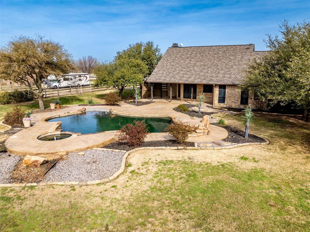 6210 Deer Run Road Sanger, TX 76266 - Photo 2 of 40 a view of a house with pool and sitting area