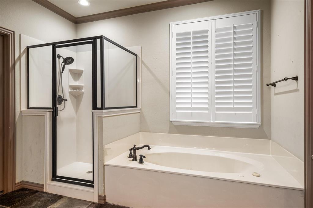 6210 Deer Run Road Sanger, TX 76266 - Photo 21 of 40 a bathroom with a bathtub and a shower