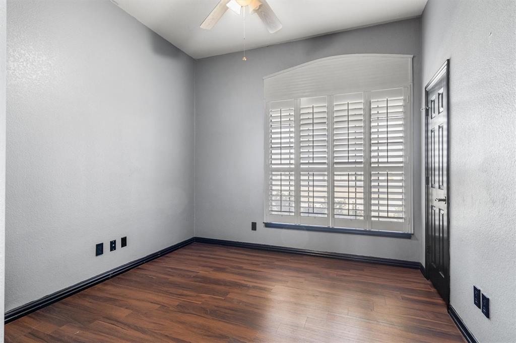 6210 Deer Run Road Sanger, TX 76266 - Photo 23 of 40 an empty room with wooden floor and windows