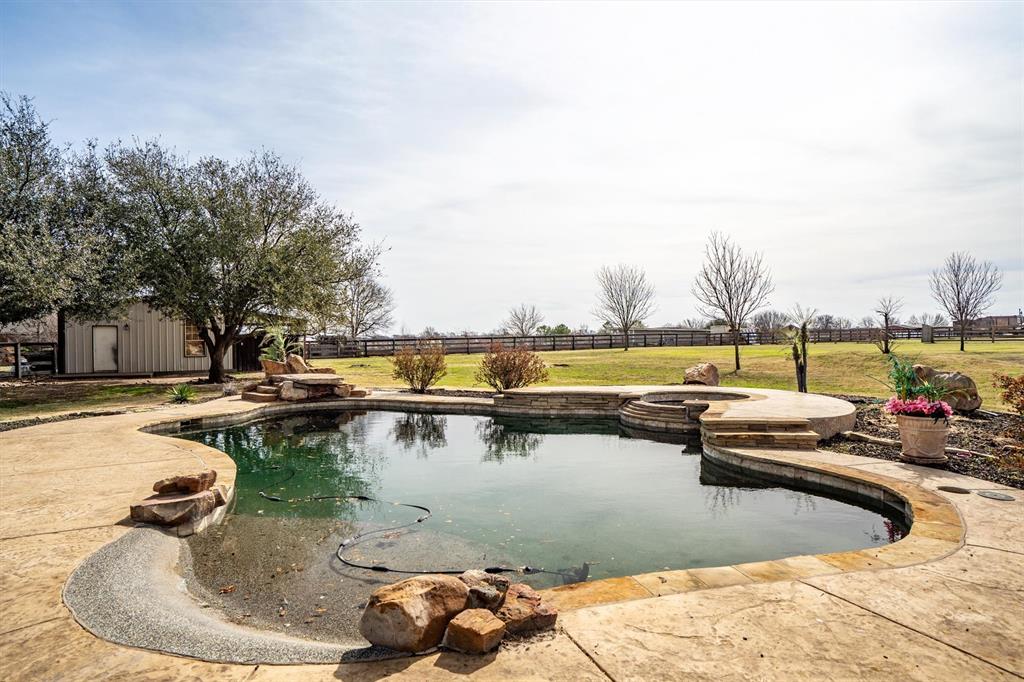 6210 Deer Run Road Sanger, TX 76266 - Photo 30 of 40 a view of a swimming pool with outdoor seating