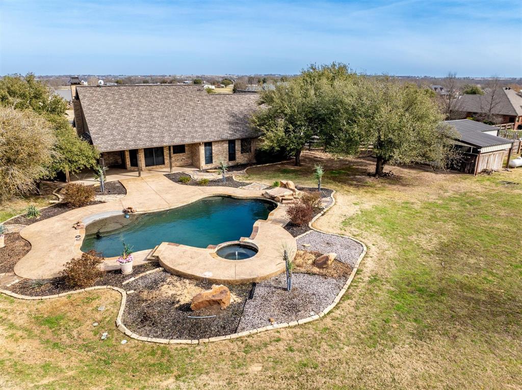 6210 Deer Run Road Sanger, TX 76266 - Photo 31 of 40 a view of a swimming pool with a patio
