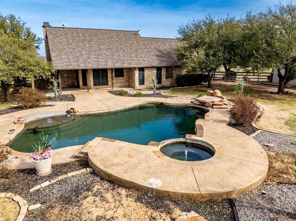 6210 Deer Run Road Sanger, TX 76266 - Photo 32 of 40 a swimming pool with outdoor seating