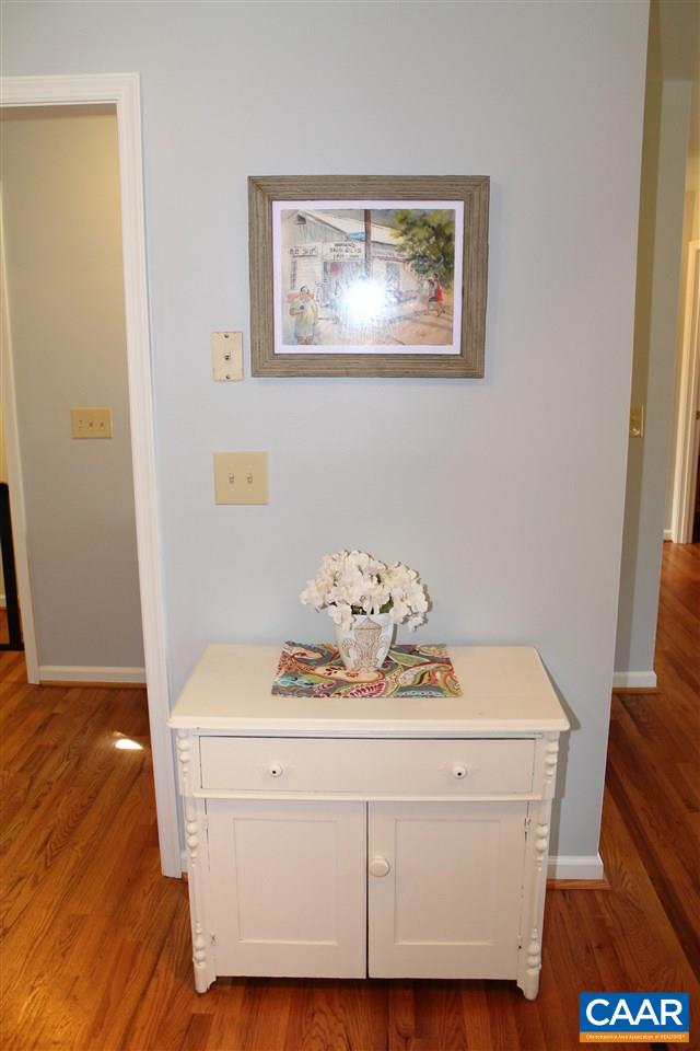 4508 Deer Bonn Road Keswick, VA 22947 - Photo 11 of 28 a room with a table and wooden floor