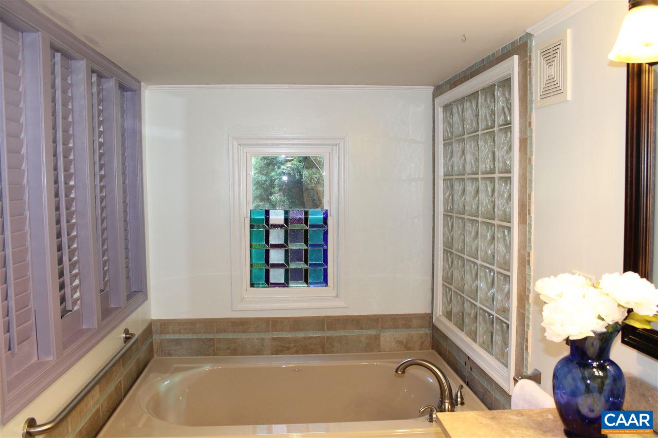 4508 Deer Bonn Road Keswick, VA 22947 - Photo 14 of 28 a bath tub sitting next to a window