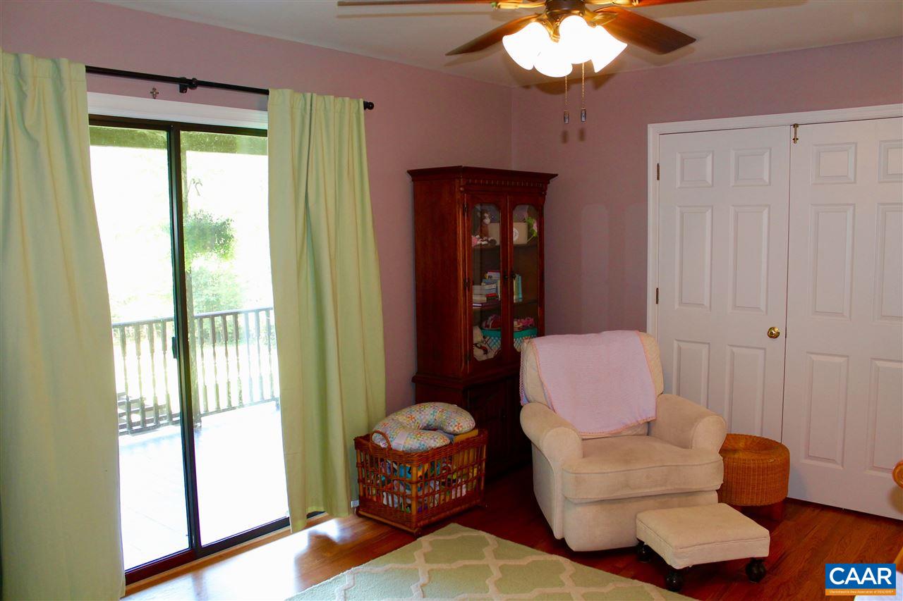 4508 Deer Bonn Road Keswick, VA 22947 - Photo 20 of 28 a living room with furniture and a large window