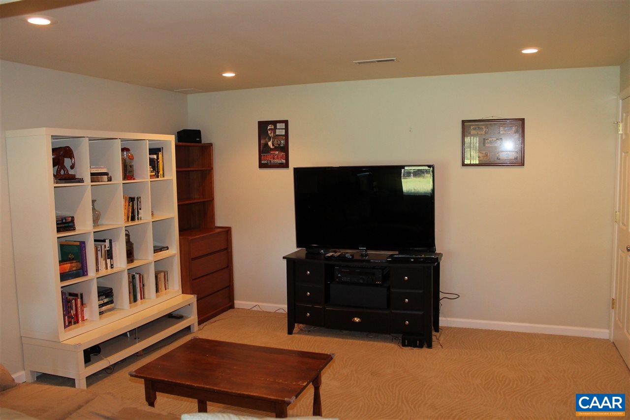 4508 Deer Bonn Road Keswick, VA 22947 - Photo 21 of 28 a living room with furniture and a flat screen tv