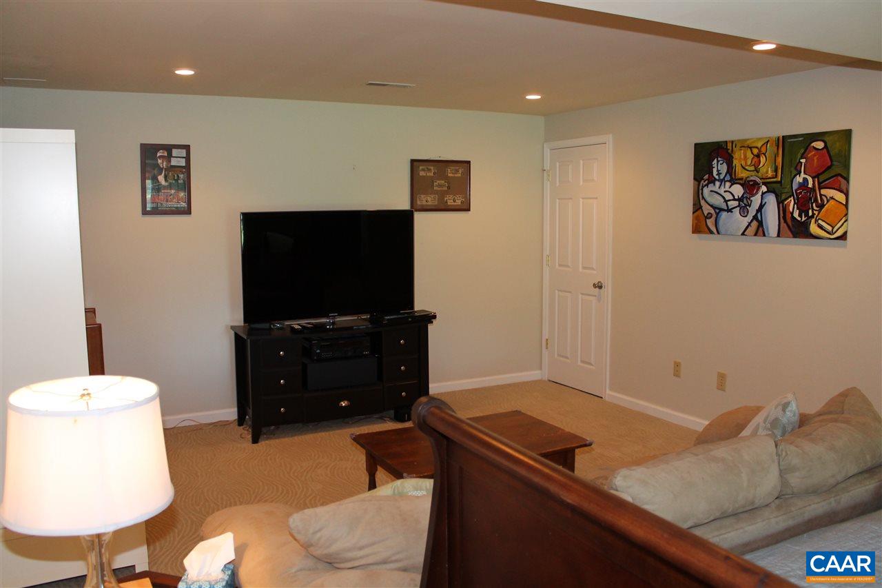 4508 Deer Bonn Road Keswick, VA 22947 - Photo 22 of 28 a living room with furniture and a flat screen tv