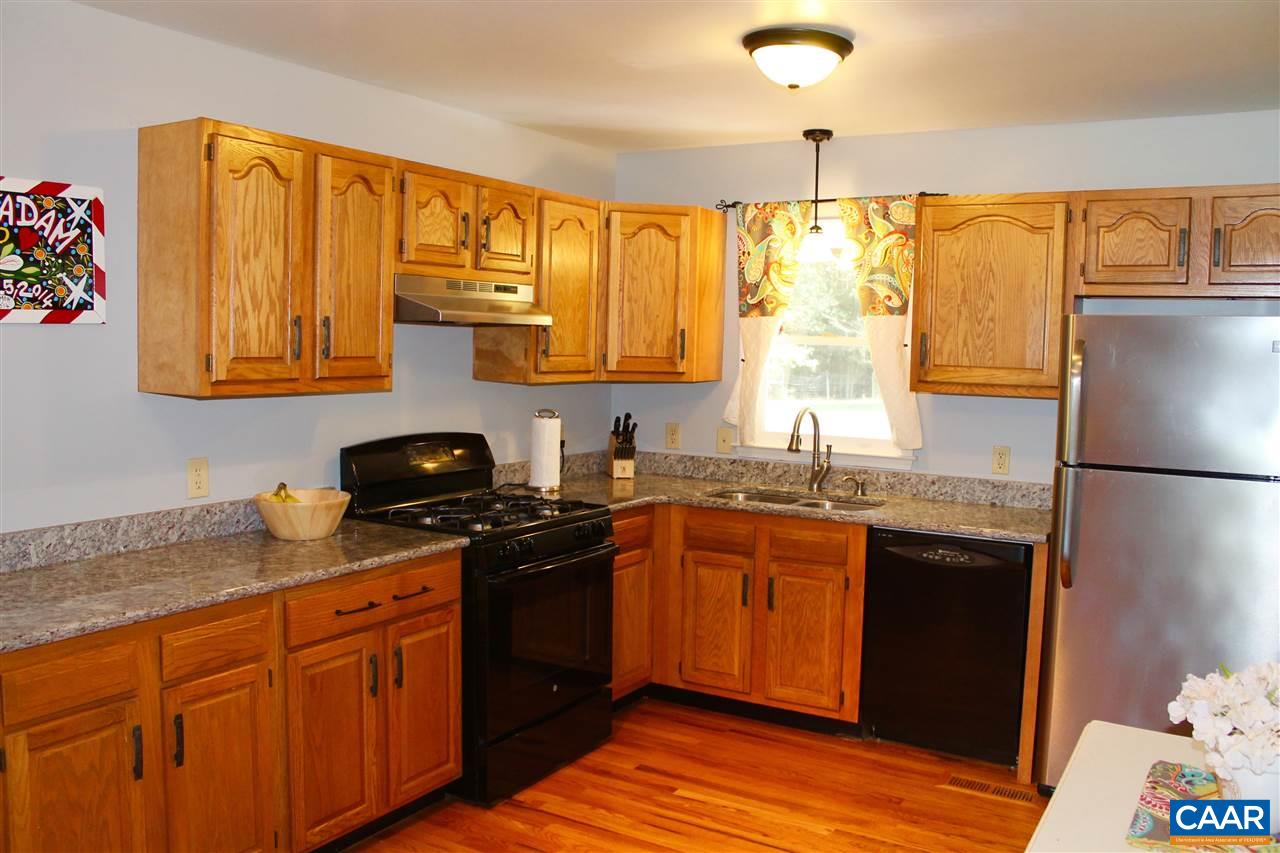 4508 Deer Bonn Road Keswick, VA 22947 - Photo 8 of 28 a kitchen with stainless steel appliances granite countertop a sink stove and refrigerator