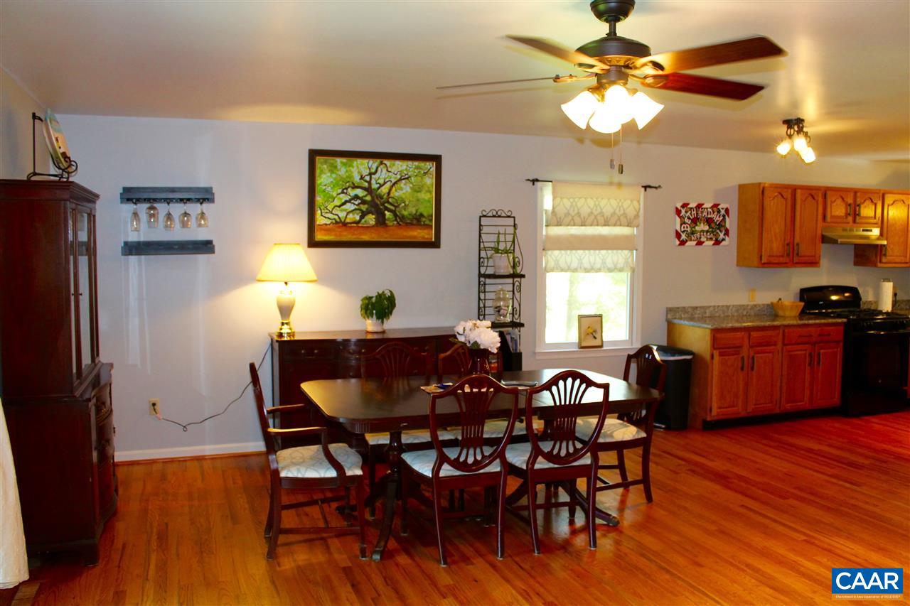 4508 Deer Bonn Road Keswick, VA 22947 - Photo 9 of 28 a view of a dining room with furniture and wooden floor