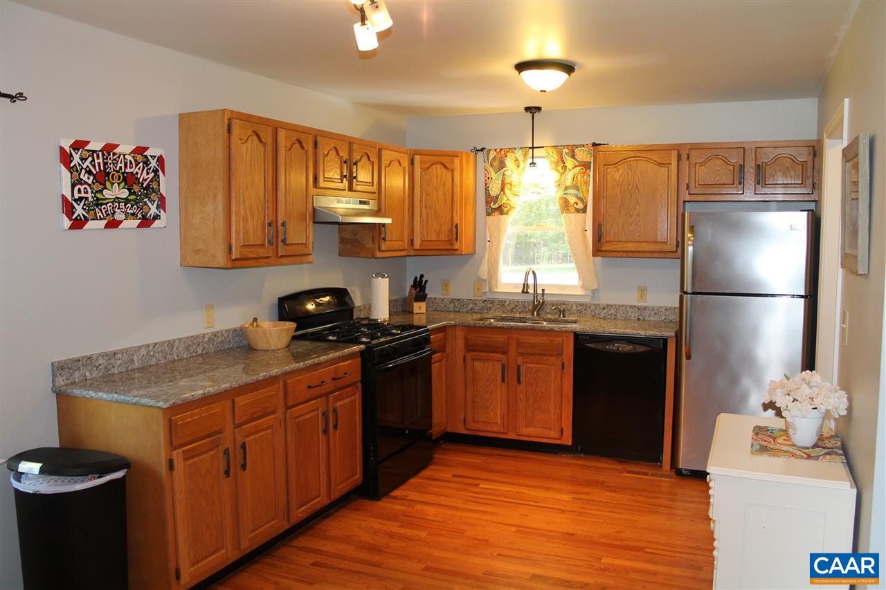 4508 Deer Bonn Road Keswick, VA 22947 - Photo 10 of 28 a kitchen with stainless steel appliances granite countertop a refrigerator and a sink