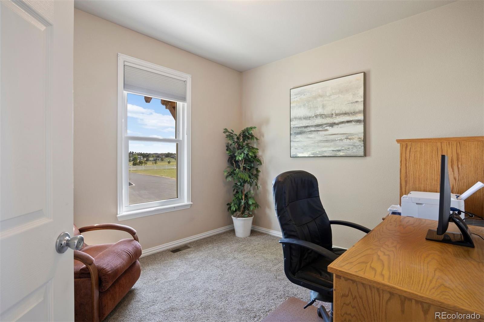 3519 Zane Grey Loop Parker, CO 80138 - Photo 23 of 40 a view of a workspace with furniture and a window