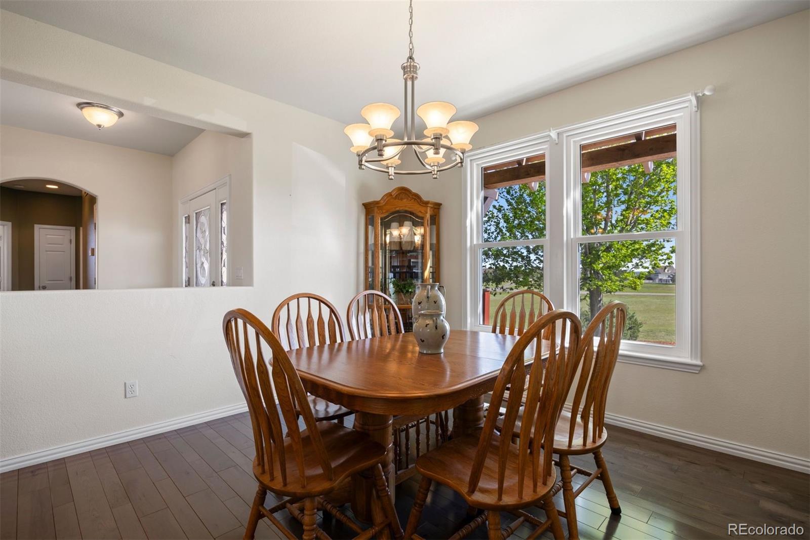 3519 Zane Grey Loop Parker, CO 80138 - Photo 24 of 40 a view of a dining room with furniture window and wooden floor