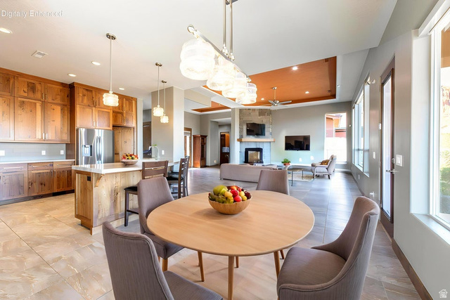322 340 E Street Ivins, UT 84738 - Photo 21 of 61 Open-concept kitchen and dining area featuring a wood-finish island with seating, stainless steel appliances, and extensive wood cabinetry