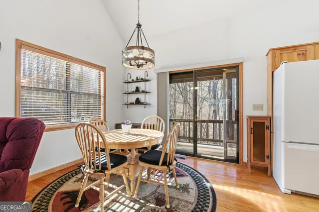 a view of living room with wooden floor
