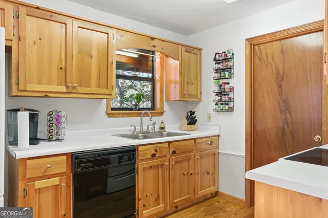 a kitchen with stainless steel appliances granite countertop a refrigerator and a stove