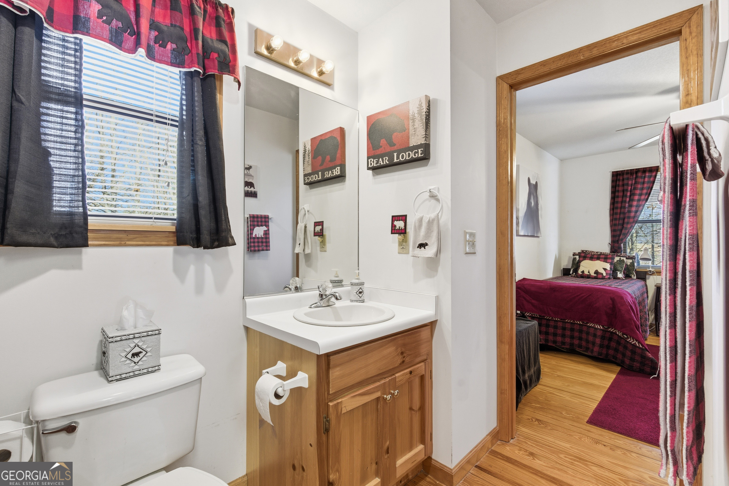 1637 Townsend Mill Road Young Harris, GA 30582 - Photo 20 of 57 a en suite bathroom with a sink toilet and mirror