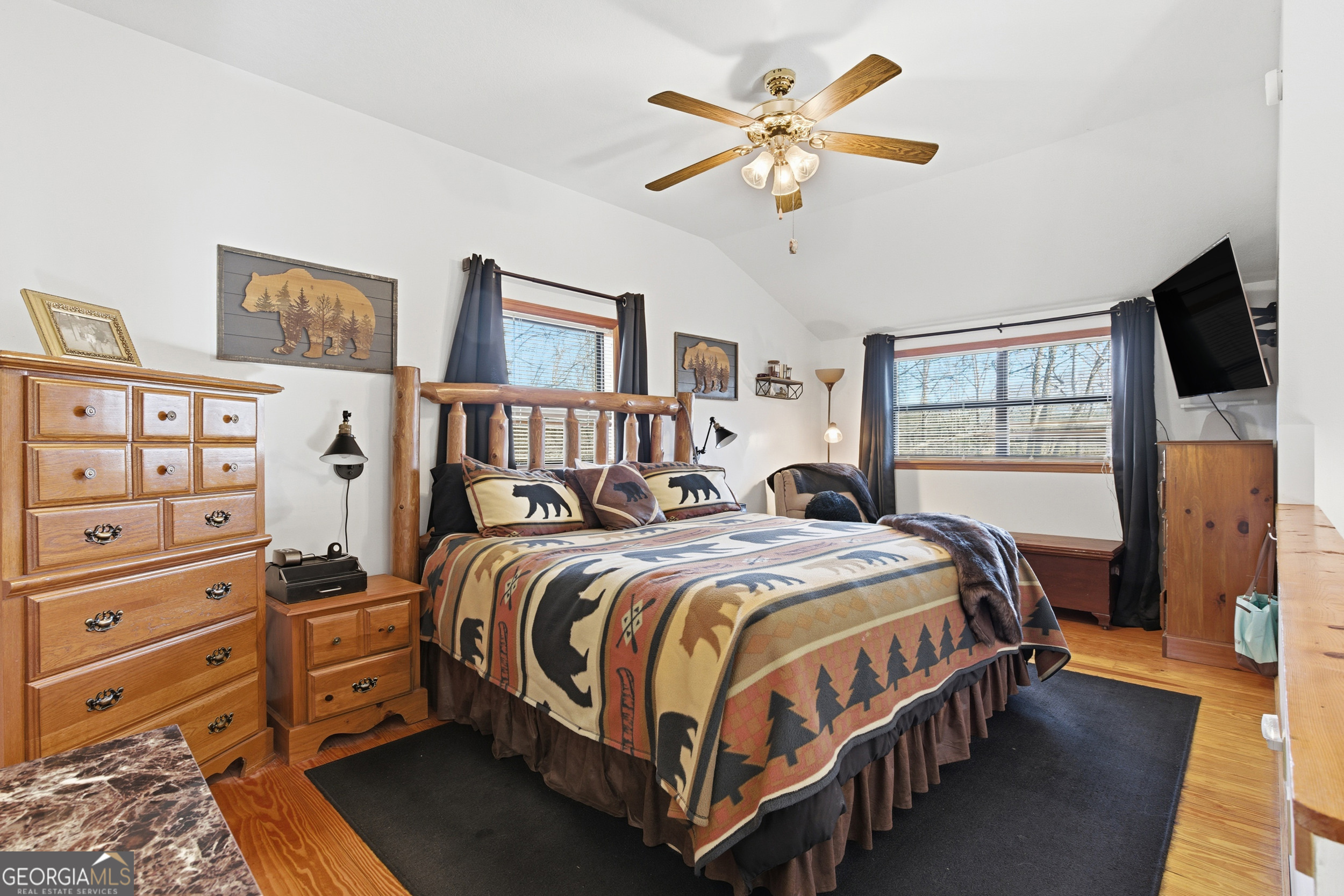 1637 Townsend Mill Road Young Harris, GA 30582 - Photo 22 of 57 a bedroom with a large bed and a tv