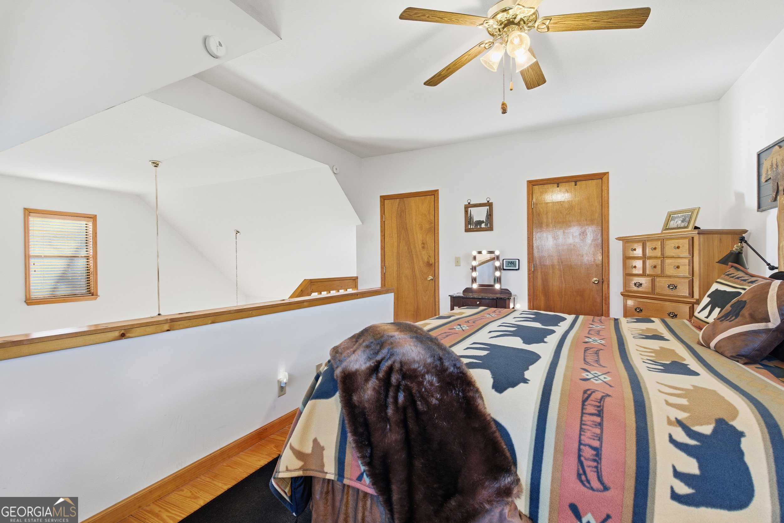 1637 Townsend Mill Road Young Harris, GA 30582 - Photo 23 of 57 a view of a bedroom with furniture and windows
