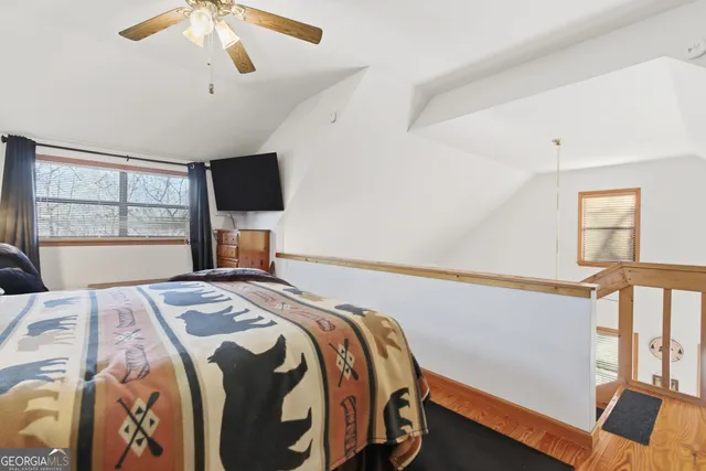 a bathroom with a sink vanity mirror and toilet