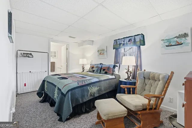 a bathroom with a sink a toilet and a shower