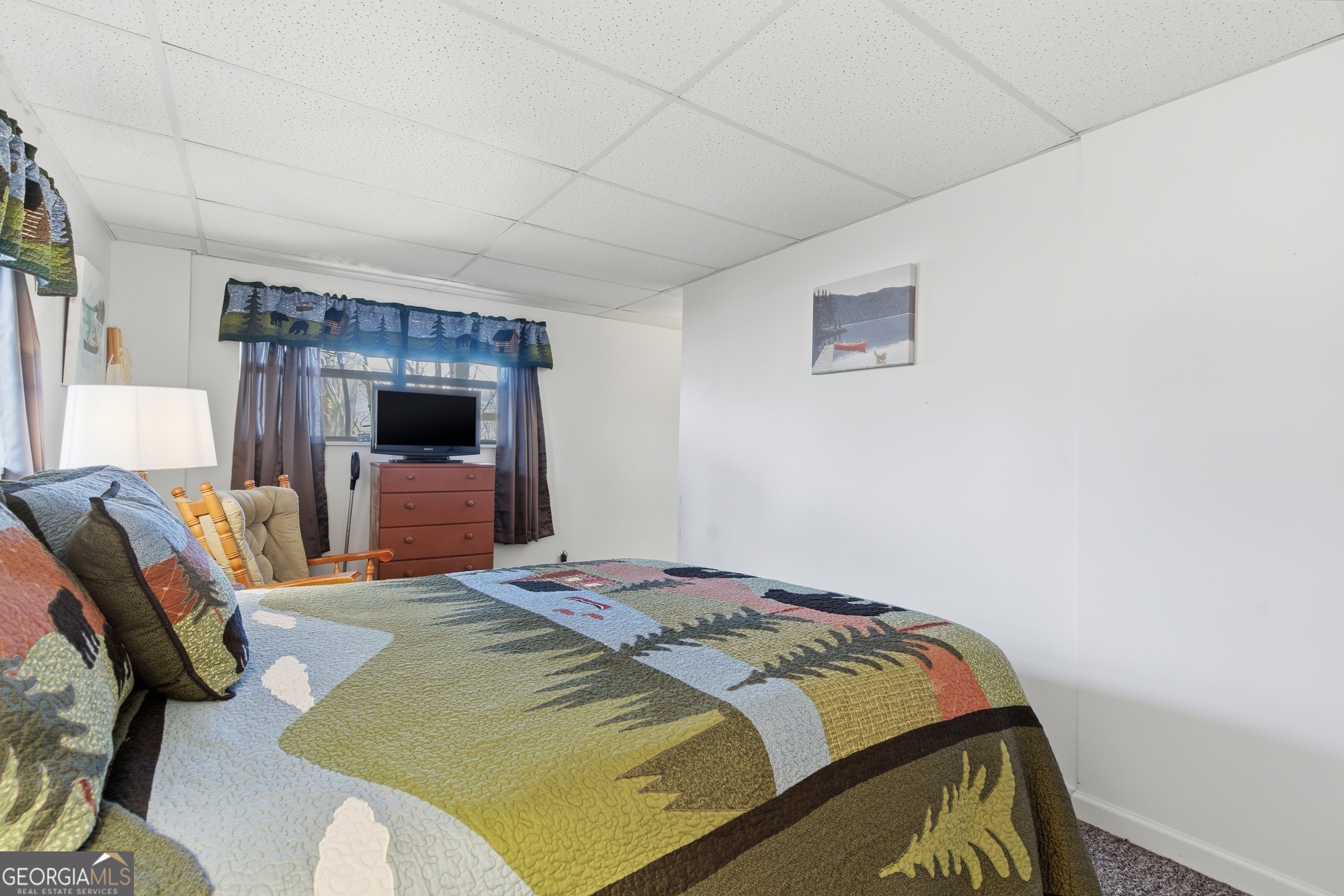 1637 Townsend Mill Road Young Harris, GA 30582 - Photo 28 of 57 a bedroom with a bed and a flat screen tv