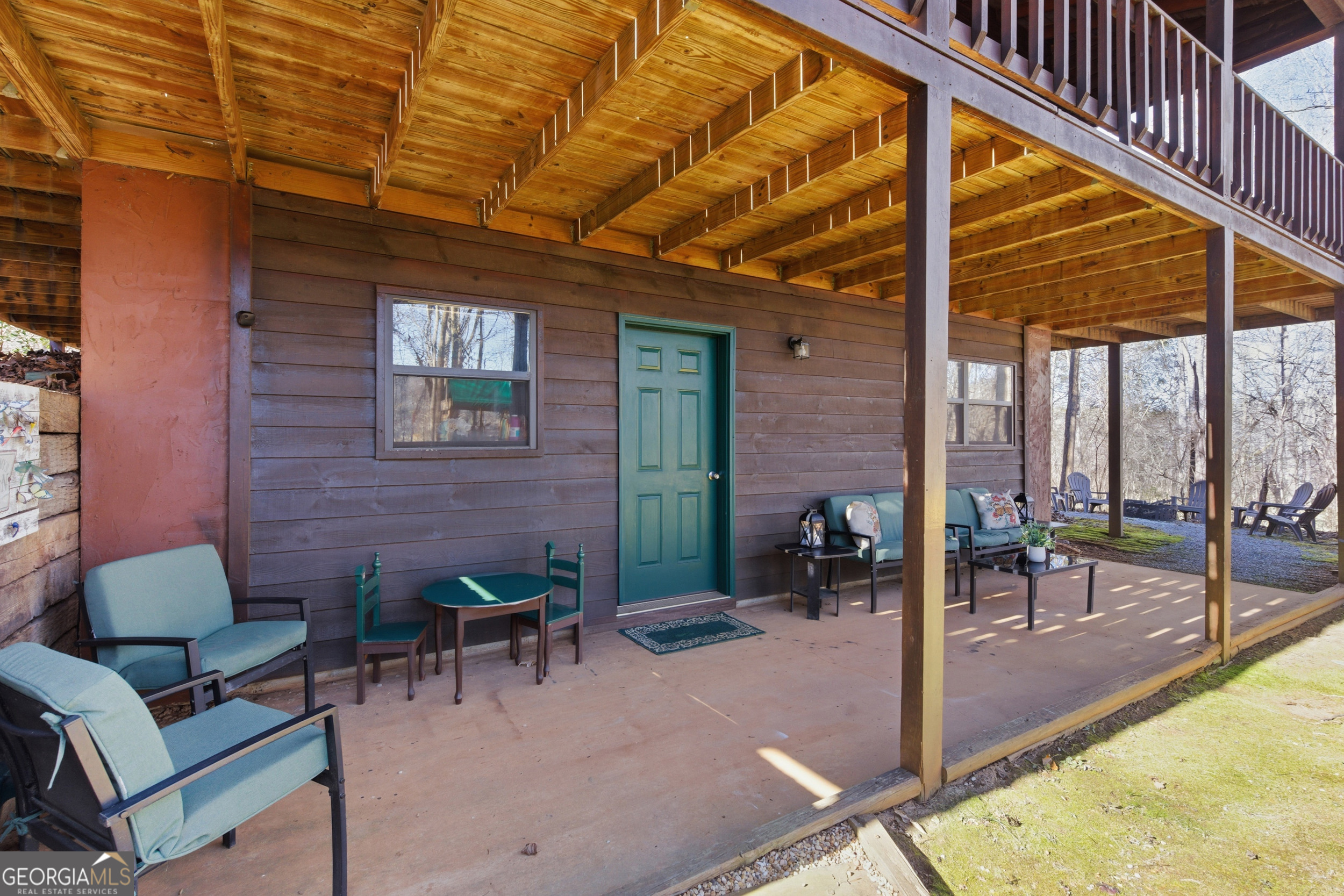 1637 Townsend Mill Road Young Harris, GA 30582 - Photo 36 of 57 a view of a porch with chairs and backyard