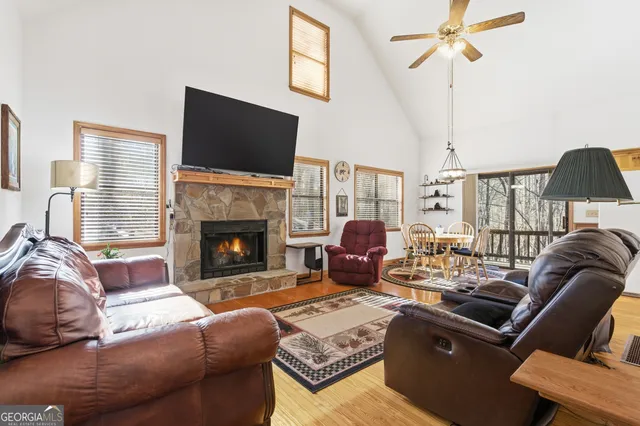 a living room with furniture rug and a table